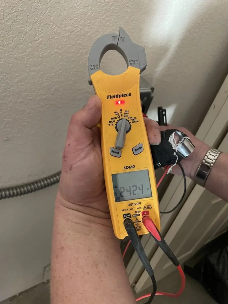 Voltage testing with clamp meter during Recessed Lighting Installation in Walhalla